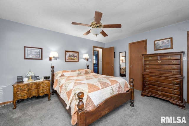 bedroom featuring light carpet, a textured ceiling, and ceiling fan