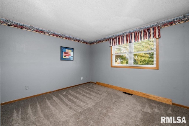 empty room with carpet flooring