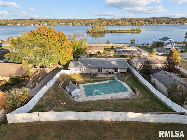 birds eye view of property with a water view