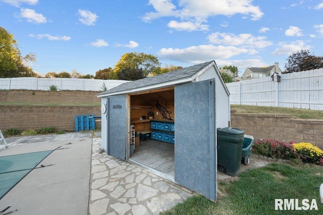 view of patio / terrace with a shed