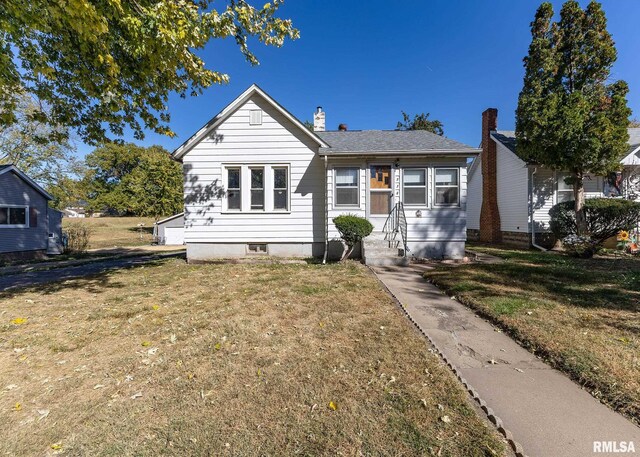 bungalow with a front yard