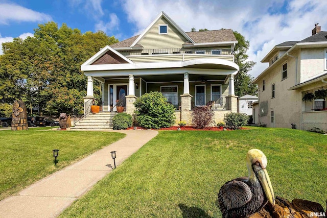 view of front of property featuring a front lawn and a porch