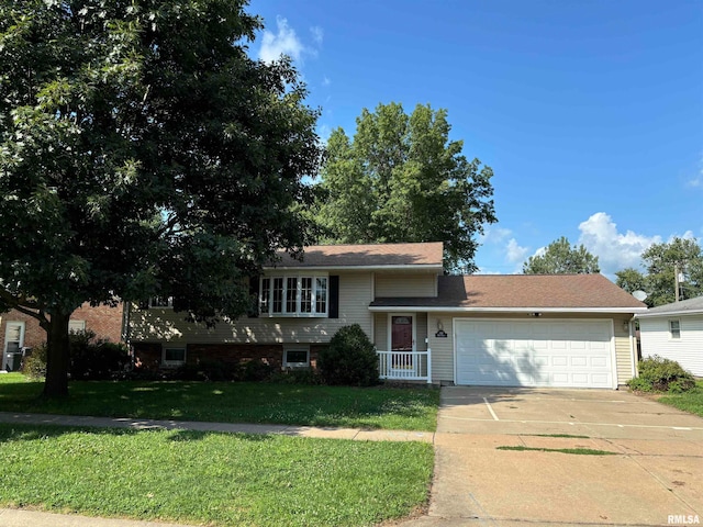 view of front facade with a garage and a front lawn