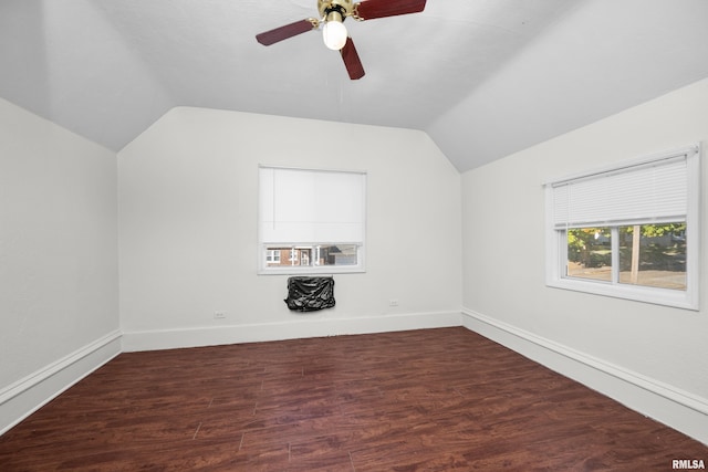 additional living space featuring lofted ceiling, dark wood-type flooring, and ceiling fan