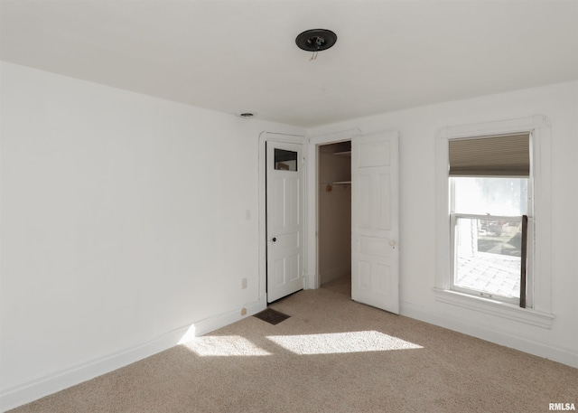 unfurnished bedroom with light carpet