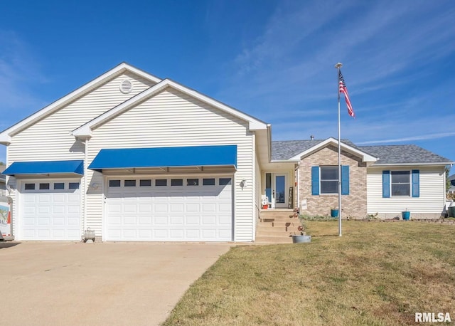 view of front facade with a garage and a front lawn