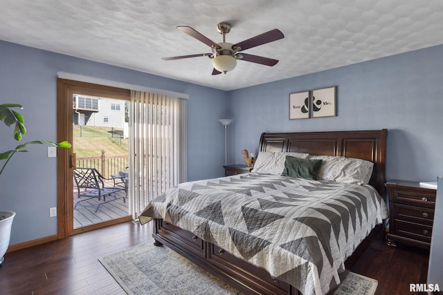 bedroom with ceiling fan, access to exterior, a textured ceiling, and dark hardwood / wood-style flooring