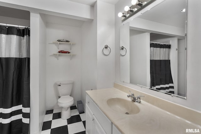 bathroom featuring vanity, toilet, and a shower with shower curtain