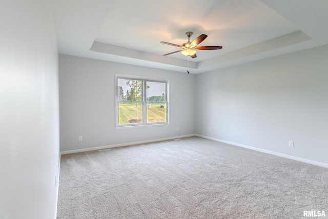 941 9th Ave N, Clinton, IA 52732 - empty room with a raised ceiling, a ceiling fan, and carpet