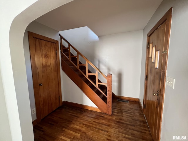 stairway featuring hardwood / wood-style floors