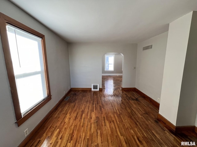 empty room featuring dark hardwood / wood-style floors