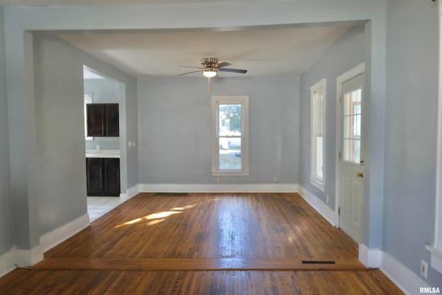 spare room with light hardwood / wood-style floors and ceiling fan