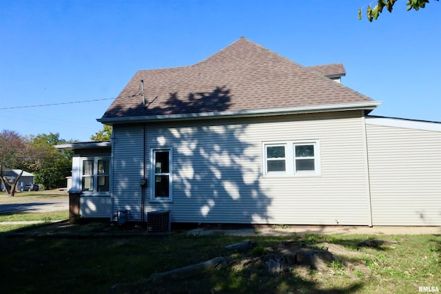 view of home's exterior with a yard