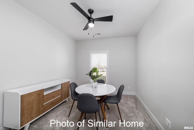 dining room featuring carpet floors and ceiling fan