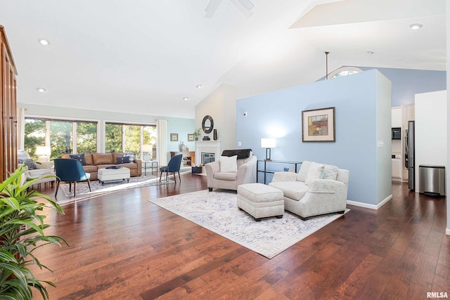 living room with dark wood-type flooring, ceiling fan, and high vaulted ceiling