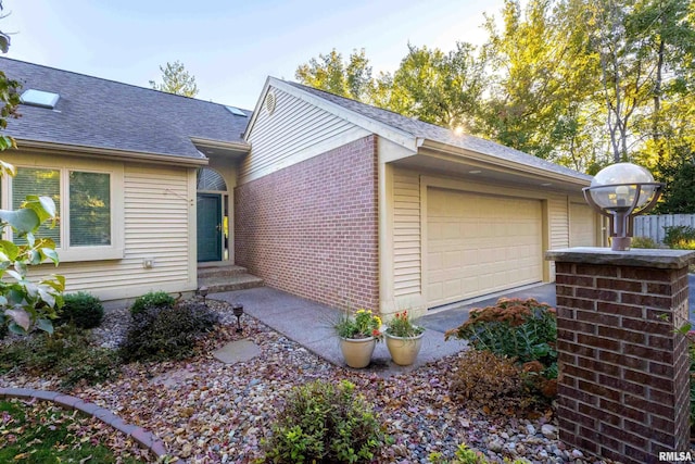 view of side of home featuring a garage