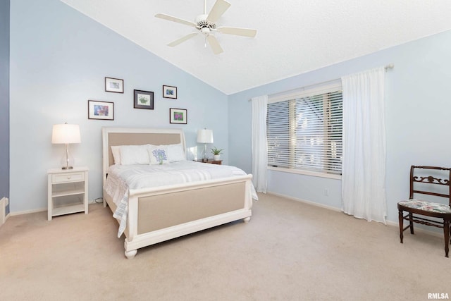 bedroom with light carpet, lofted ceiling, and ceiling fan