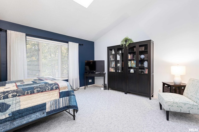 bedroom featuring carpet and lofted ceiling