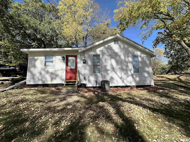 back of house featuring entry steps and central AC