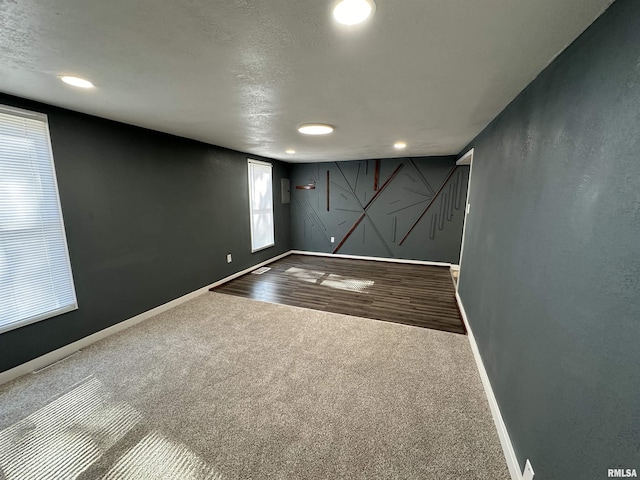 below grade area with baseboards, carpet floors, and recessed lighting