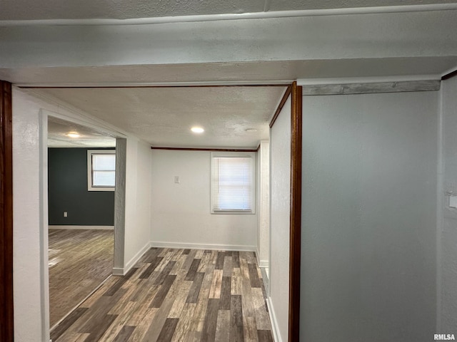 hallway with dark hardwood / wood-style floors