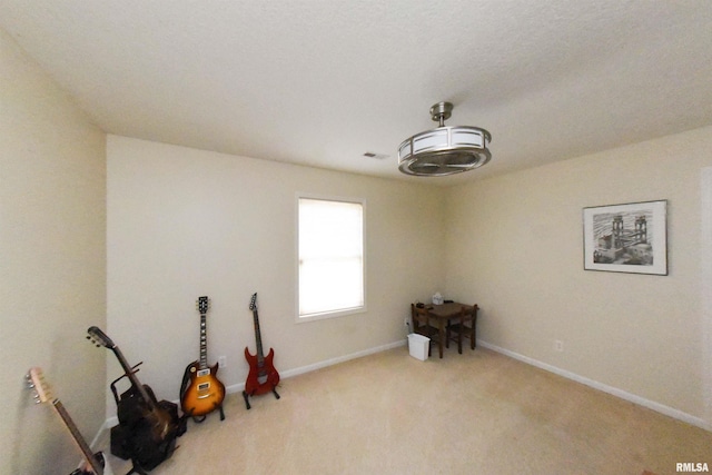 miscellaneous room with light colored carpet