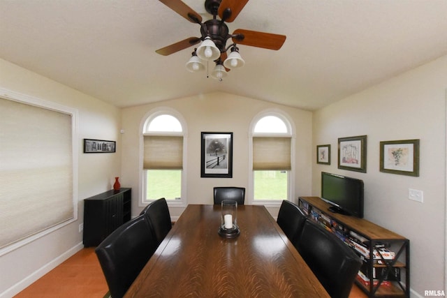 dining space with a wealth of natural light, lofted ceiling, and ceiling fan