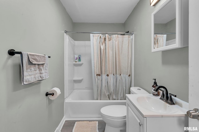 full bathroom with vanity, shower / bath combo with shower curtain, and toilet