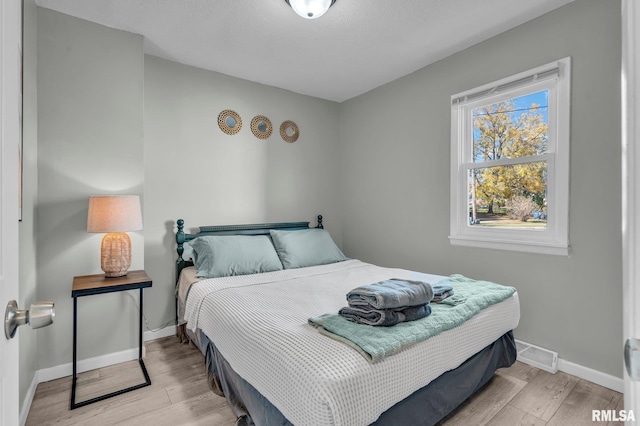 bedroom featuring light hardwood / wood-style floors