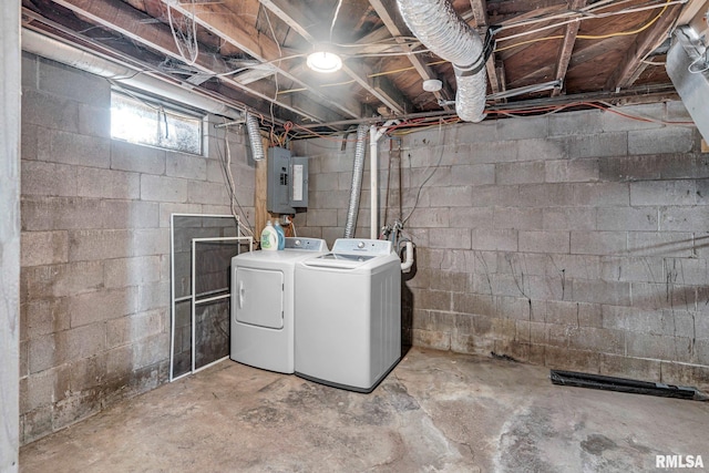 basement featuring electric panel and washing machine and dryer