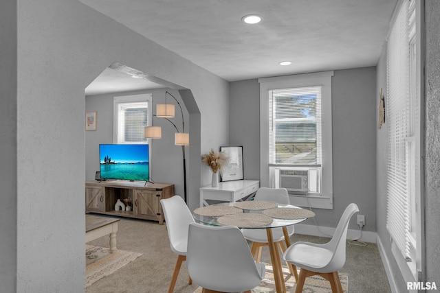 carpeted dining room featuring cooling unit