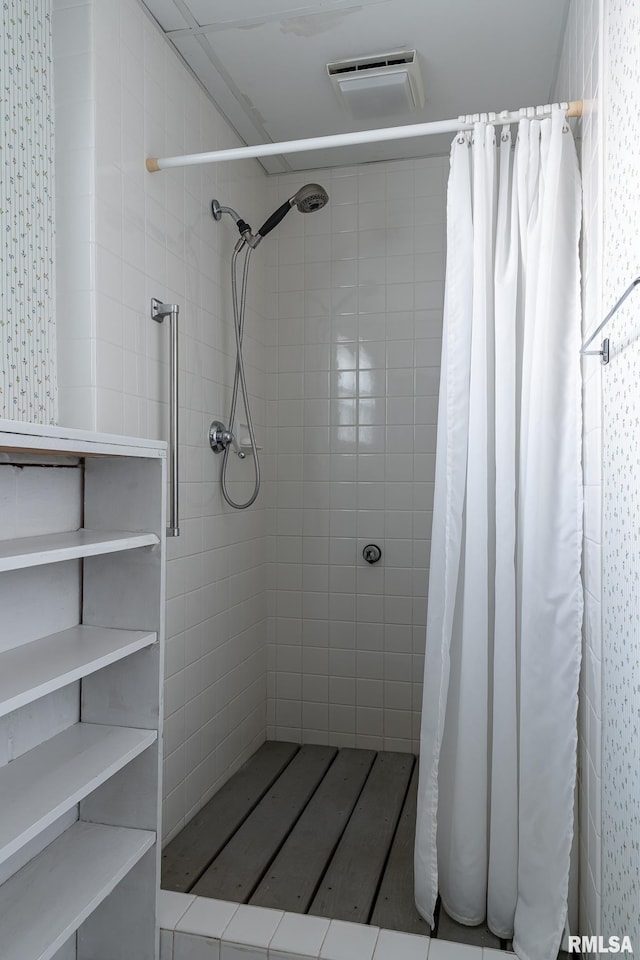 bathroom with a shower with shower curtain