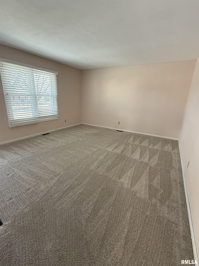 empty room with carpet flooring