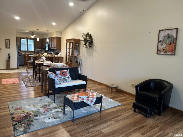 living room with light wood-style flooring and baseboards