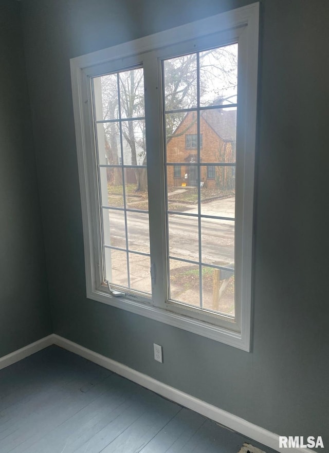 spare room featuring hardwood / wood-style flooring