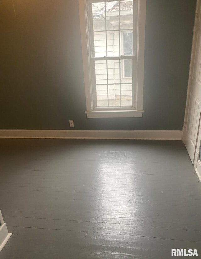 empty room featuring hardwood / wood-style flooring