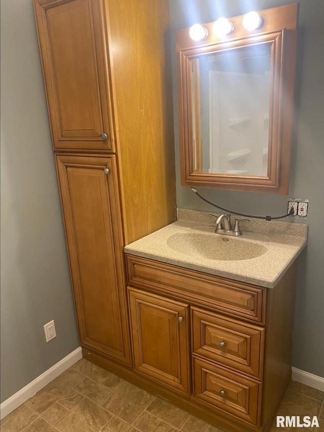 1621 14 1/2 St, Rock Island, IL 61201 - bathroom featuring baseboards and vanity