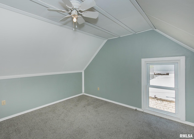 bonus room with vaulted ceiling, carpet flooring, and ceiling fan