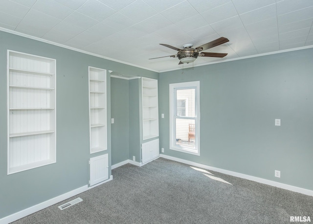 unfurnished bedroom featuring ceiling fan, carpet flooring, and ornamental molding