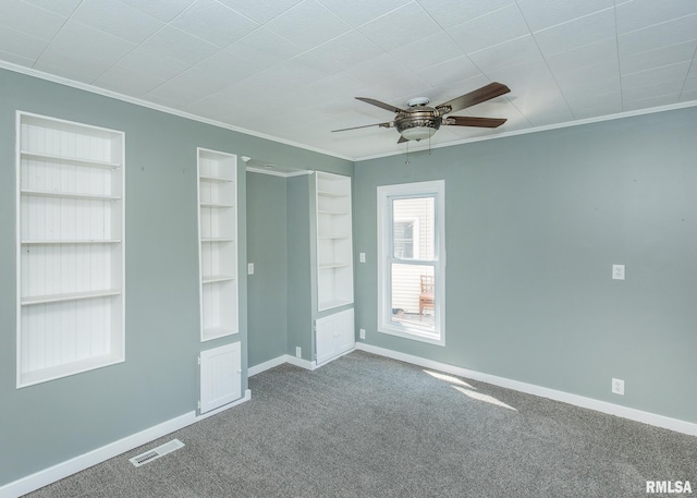 1325 13th Ave, East Moline, IL 61264 - carpeted empty room with ornamental molding, ceiling fan, and built in features