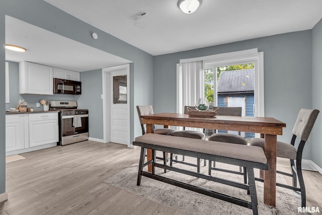 dining room with light hardwood / wood-style floors