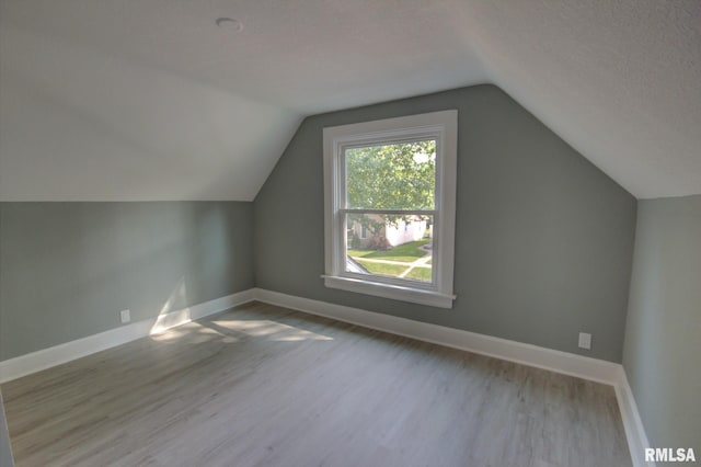 2312 W 1st St, Davenport, IA 52802 - bonus room featuring wood finished floors and lofted ceiling
