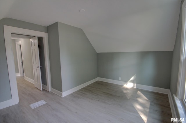 2312 W 1st St, Davenport, IA 52802 - additional living space with vaulted ceiling and wood finished floors