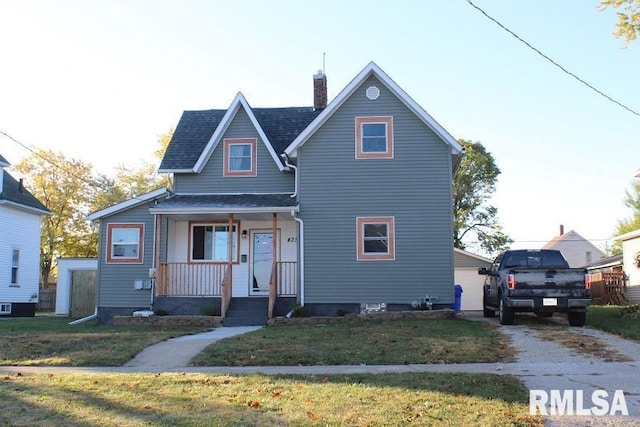 view of front facade featuring a front yard, a porch, and central AC