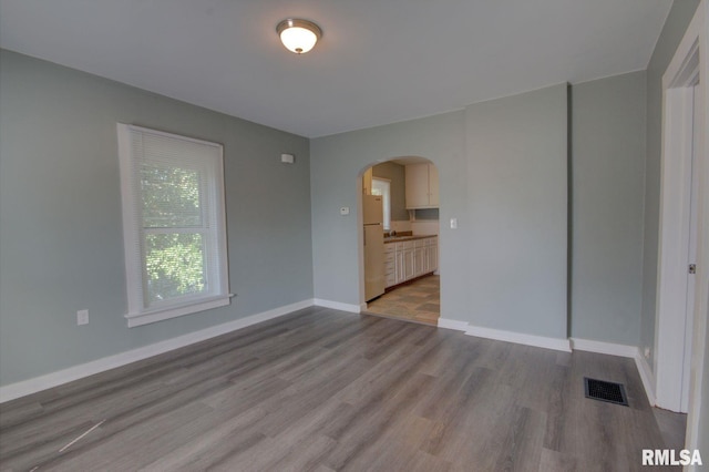 empty room with light hardwood / wood-style floors