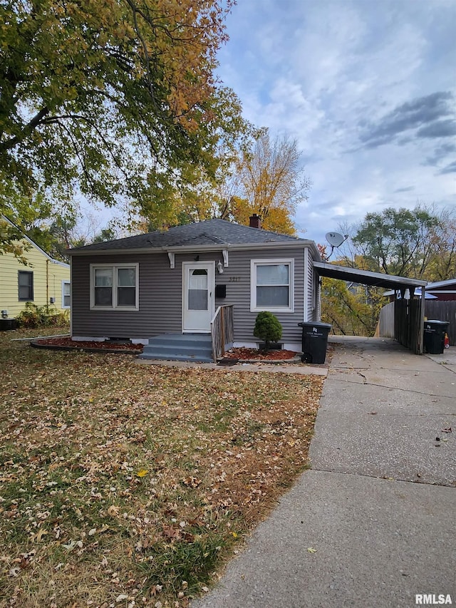 view of front of property with a carport