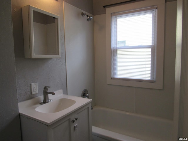 bathroom with vanity and shower / tub combination