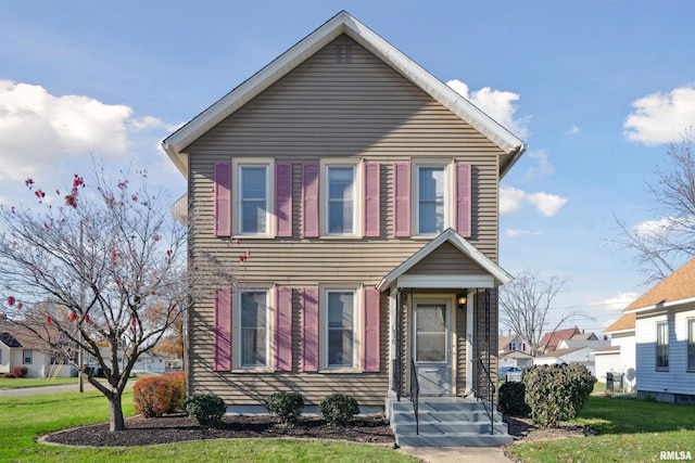 view of front of property featuring a front yard