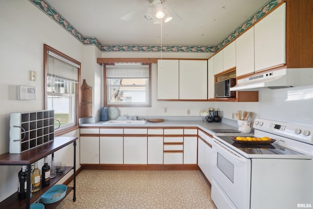 kitchen with white cabinetry, white electric stove, ceiling fan, and sink