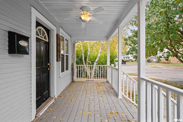 wooden deck with ceiling fan and a porch